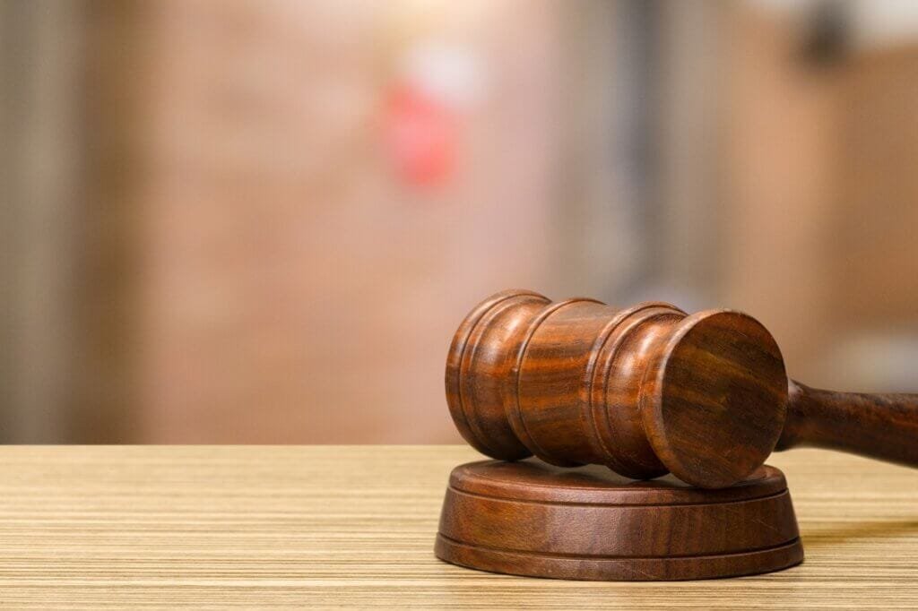 Wooden gavel on table close up. Justice concept